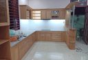 Tủ bếp gỗ sồ Nga chữ L kết hợp quầy bar gia đình ở Quận 12 GS-077